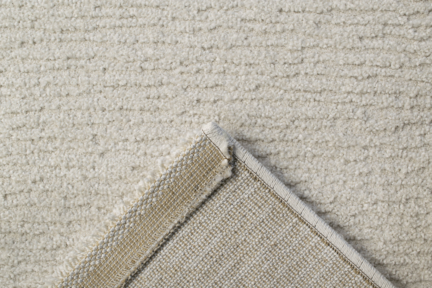 Quin Solid Ivory Solid Color High-Low Rug