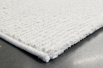 Quin Solid Ivory Solid Color High-Low Rug