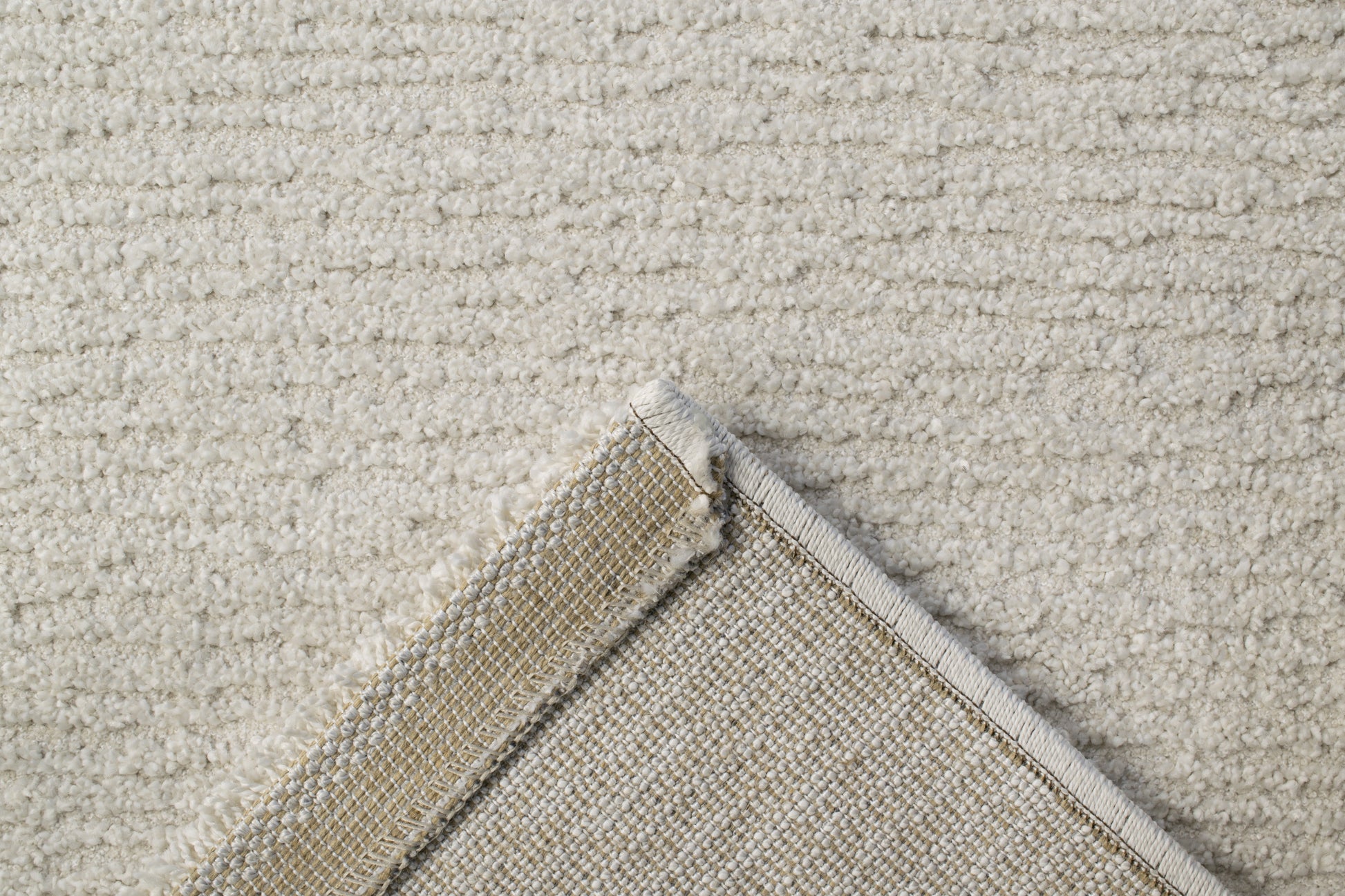 Quin Solid Ivory Solid Color High-Low Rug