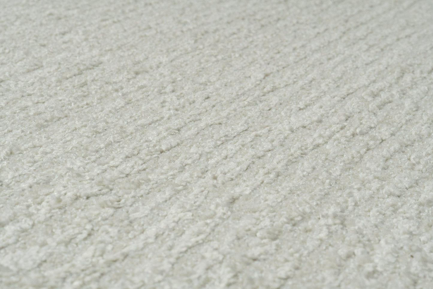 Quin Solid Ivory Solid Color High-Low Rug