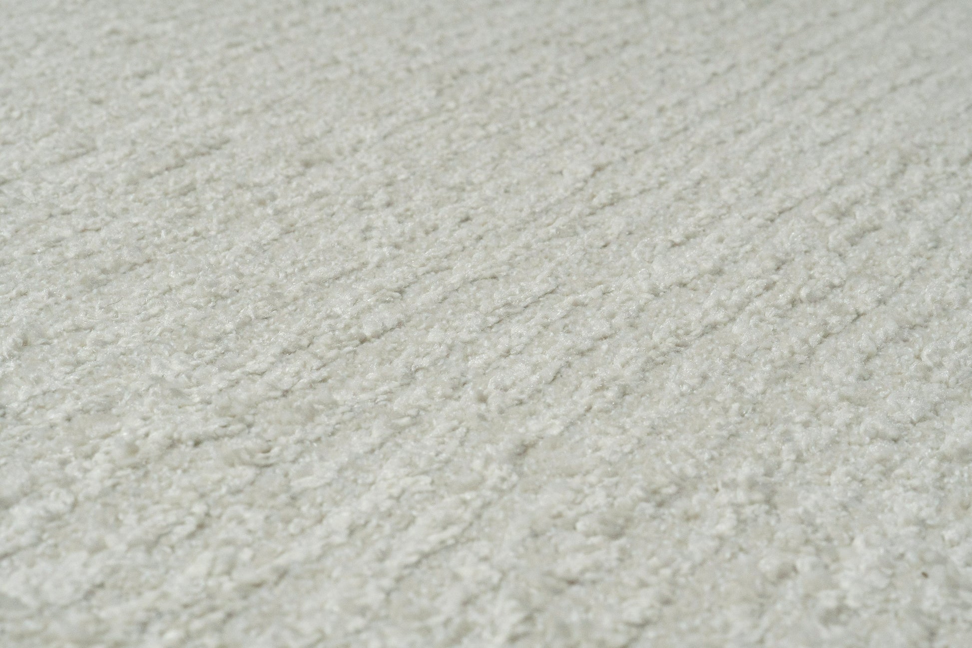 Quin Solid Ivory Solid Color High-Low Rug