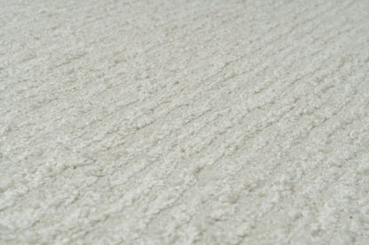 Quin Solid Ivory Solid Color High-Low Rug