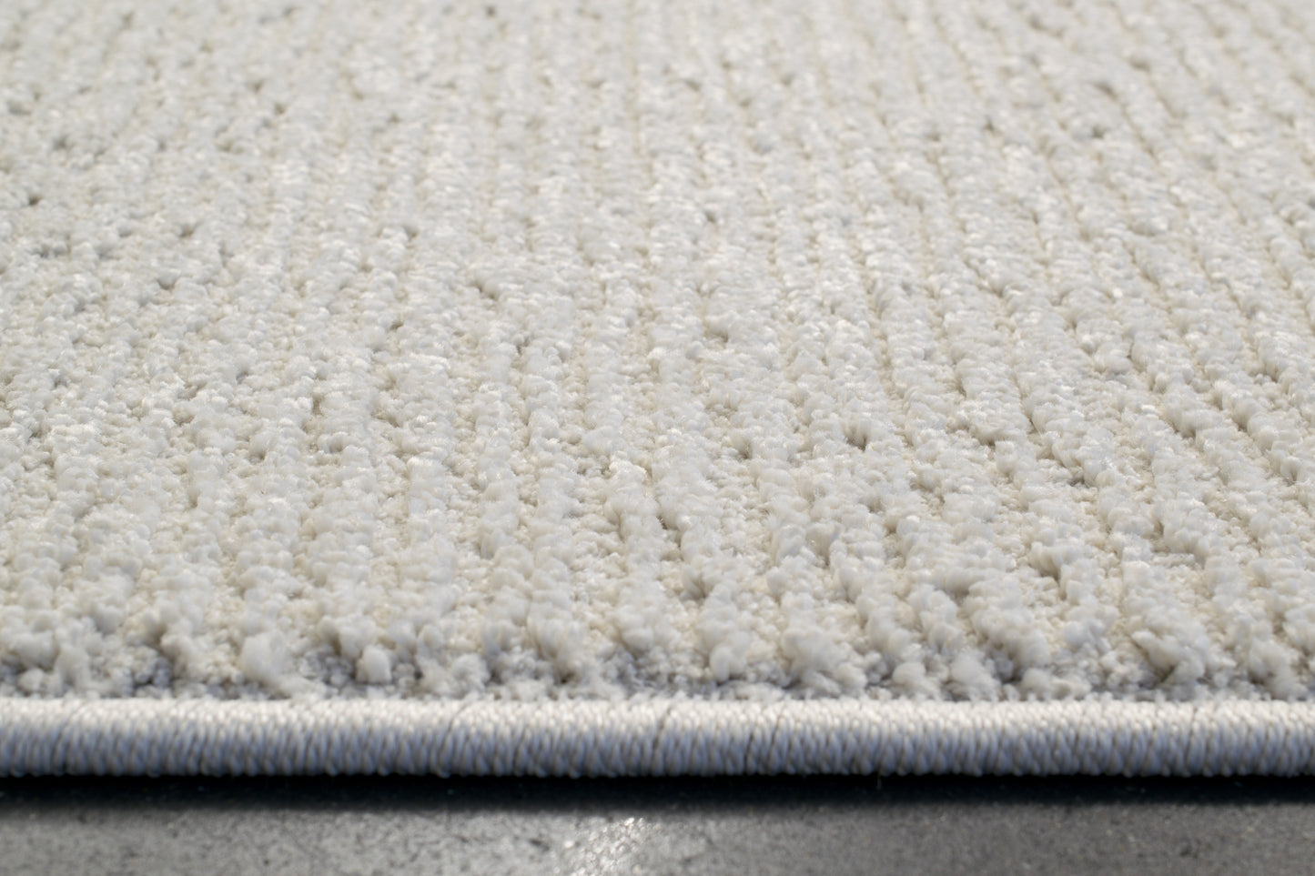 Quin Solid Ivory Solid Color High-Low Rug