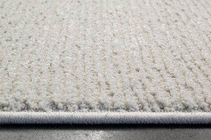 Quin Solid Ivory Solid Color High-Low Rug