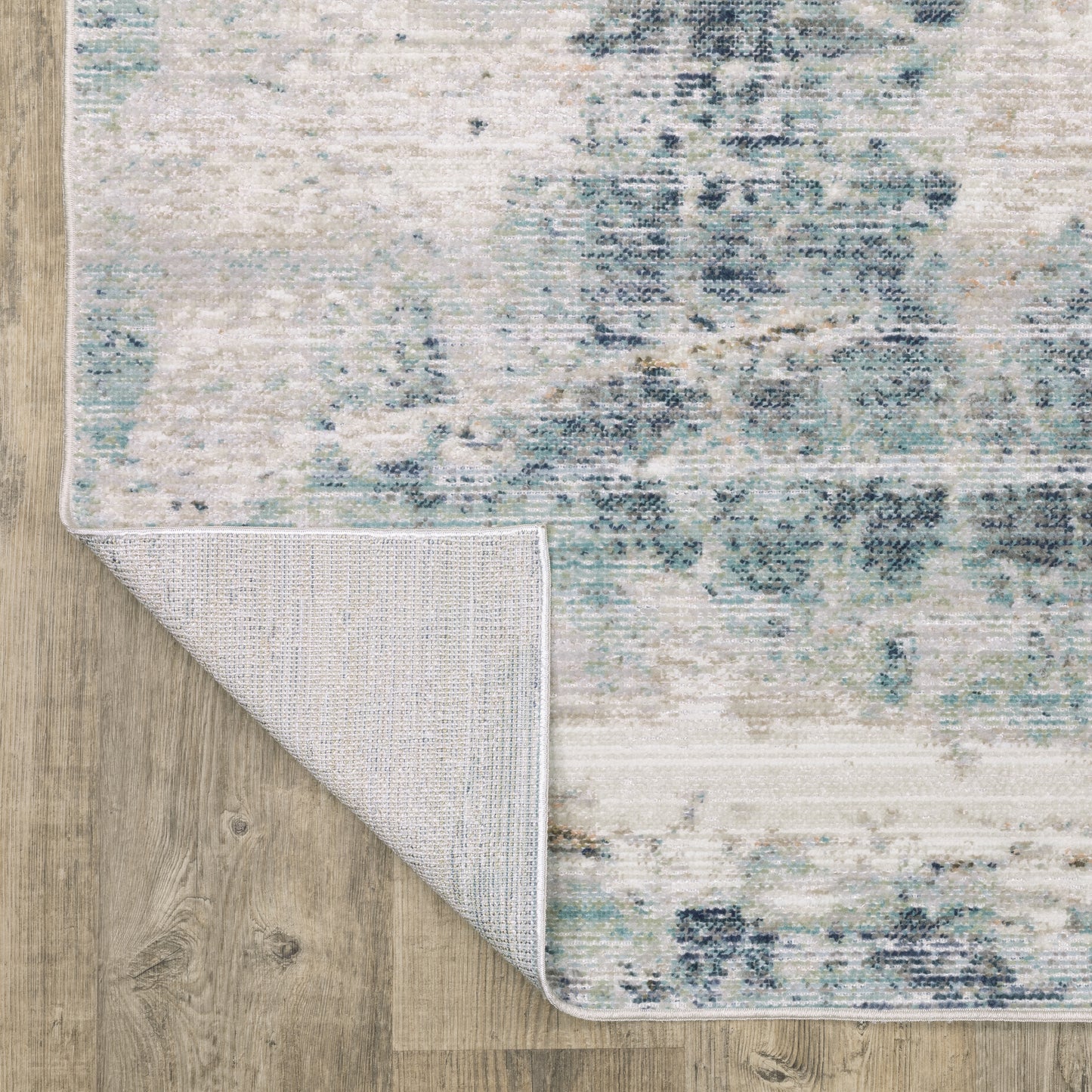 Cavett Distressed Ivory/ Blue Abstract Cut Pile Rug