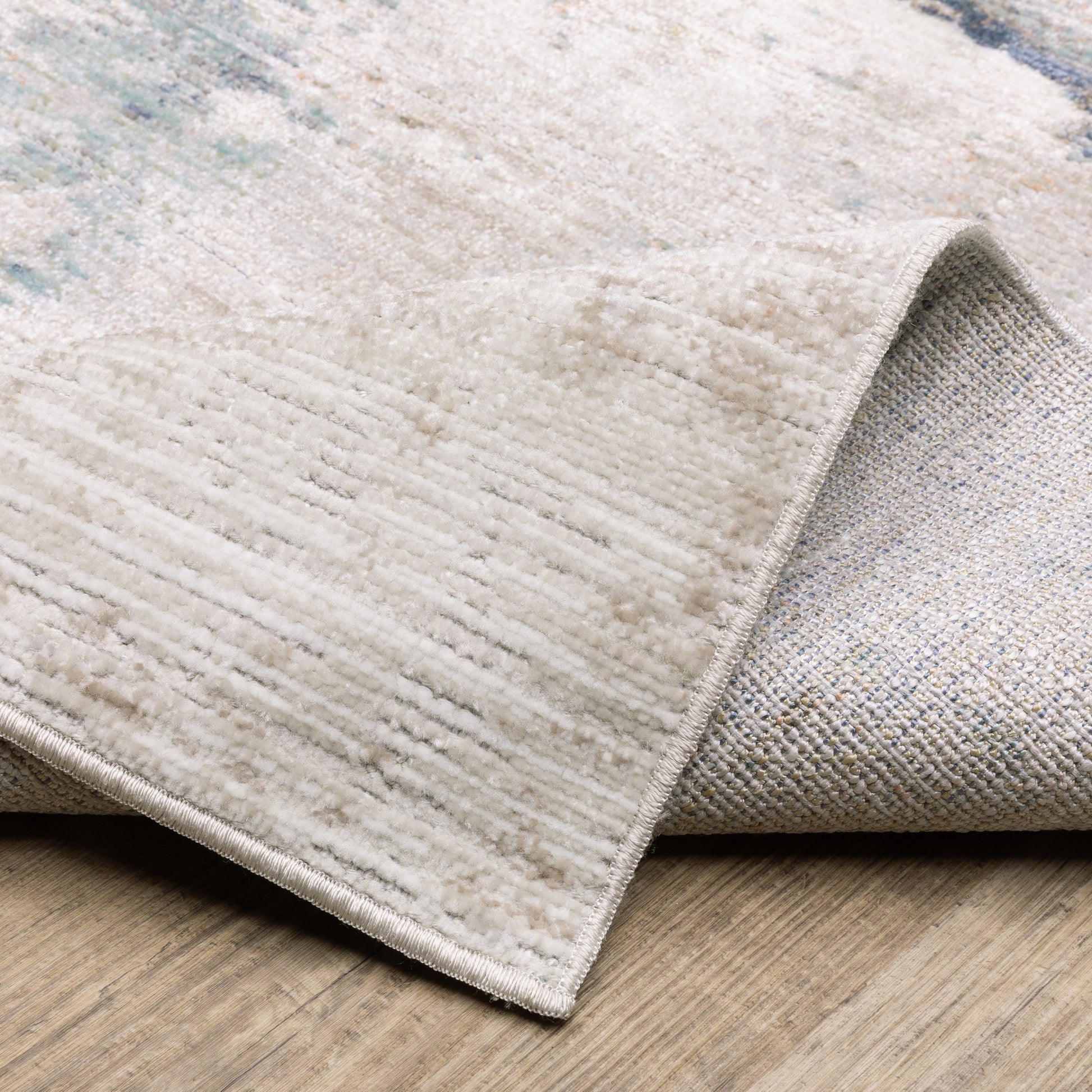 Cavett Distressed Ivory/ Blue Abstract Cut Pile Rug