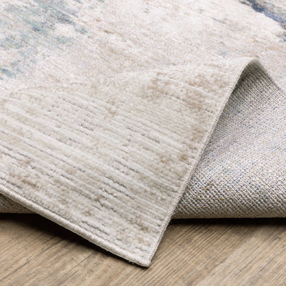 Cavett Distressed Ivory/ Blue Abstract Cut Pile Rug