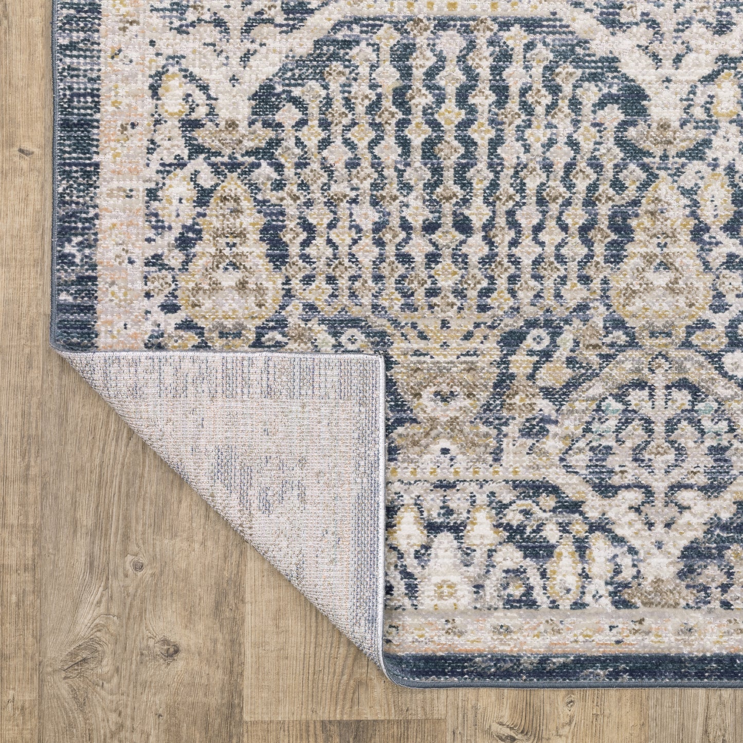 Cavett Distressed Blue/ Gold Floral Cut Pile Rug