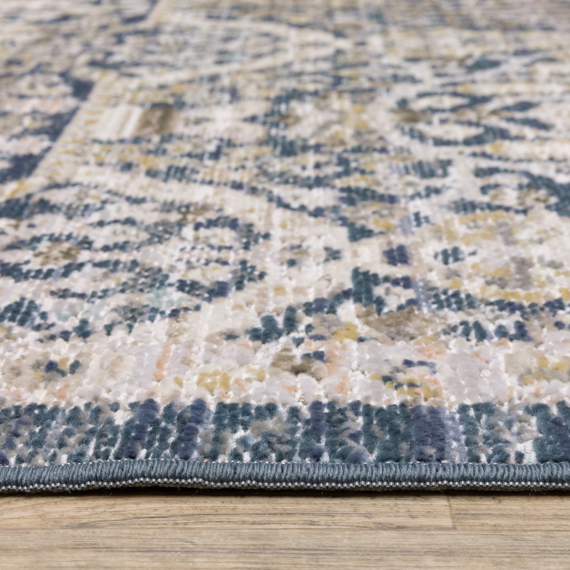 Cavett Distressed Blue/ Gold Floral Cut Pile Rug