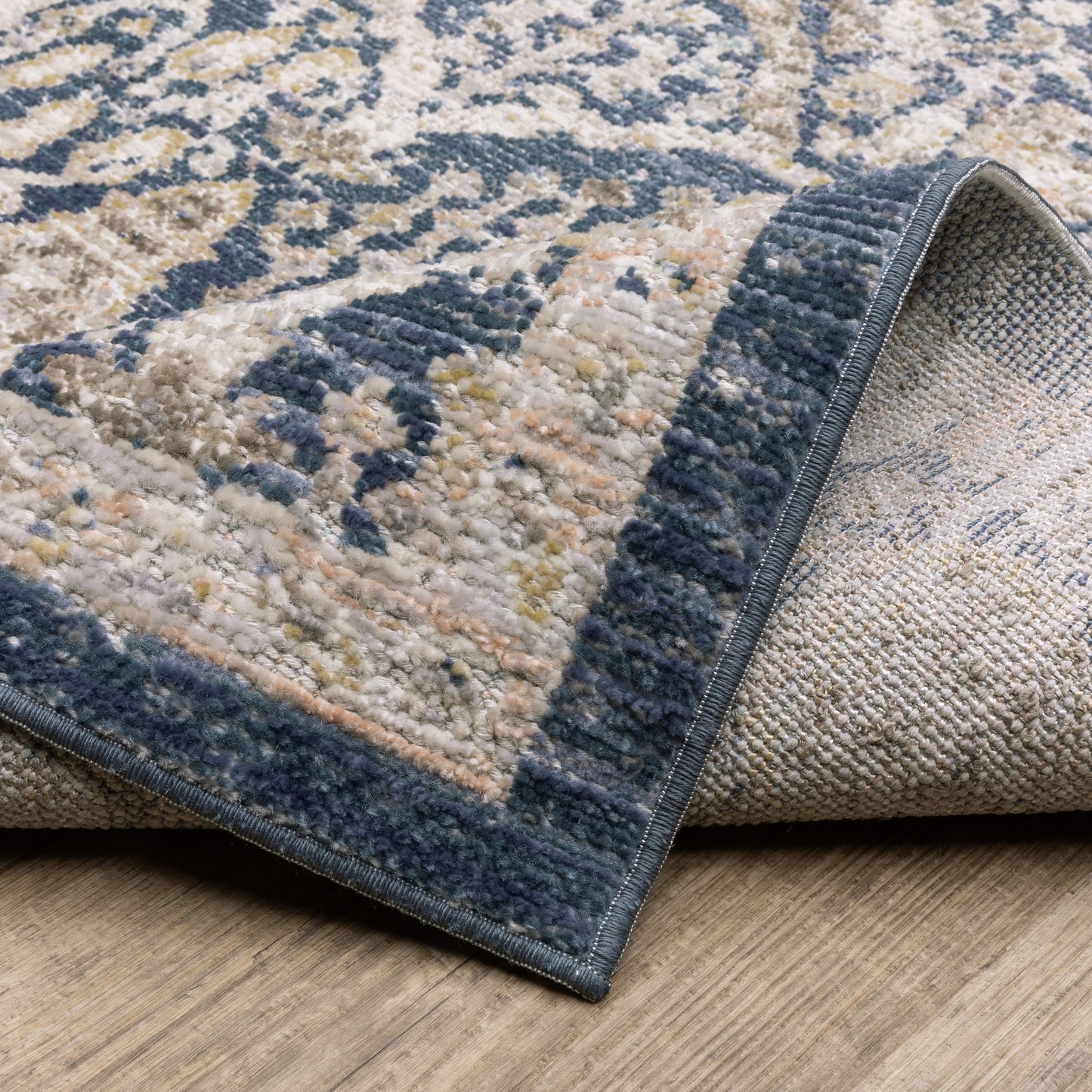 Cavett Distressed Blue/ Gold Floral Cut Pile Rug