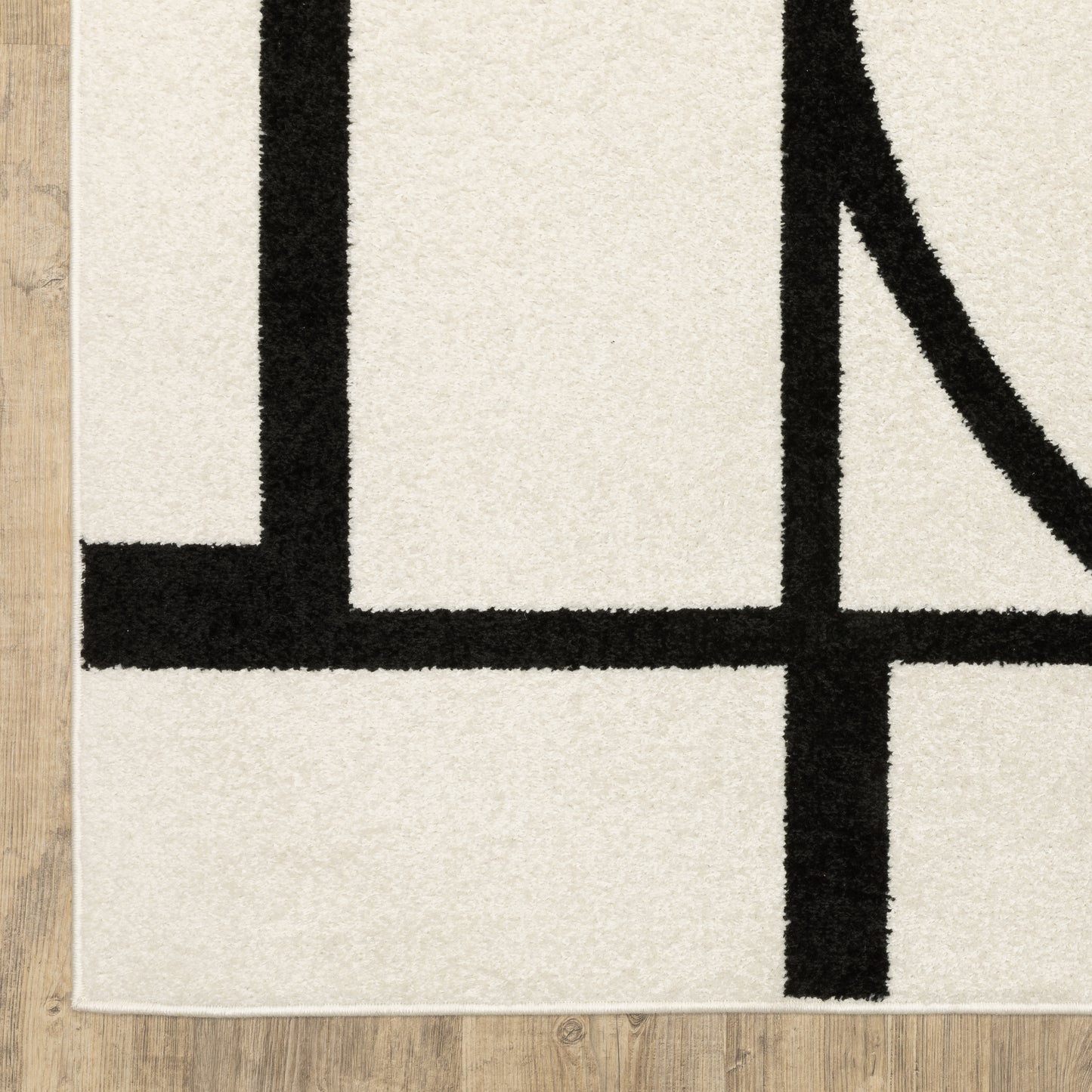 Quinn Circles Ivory/ Black Abstract Cut Pile Rug