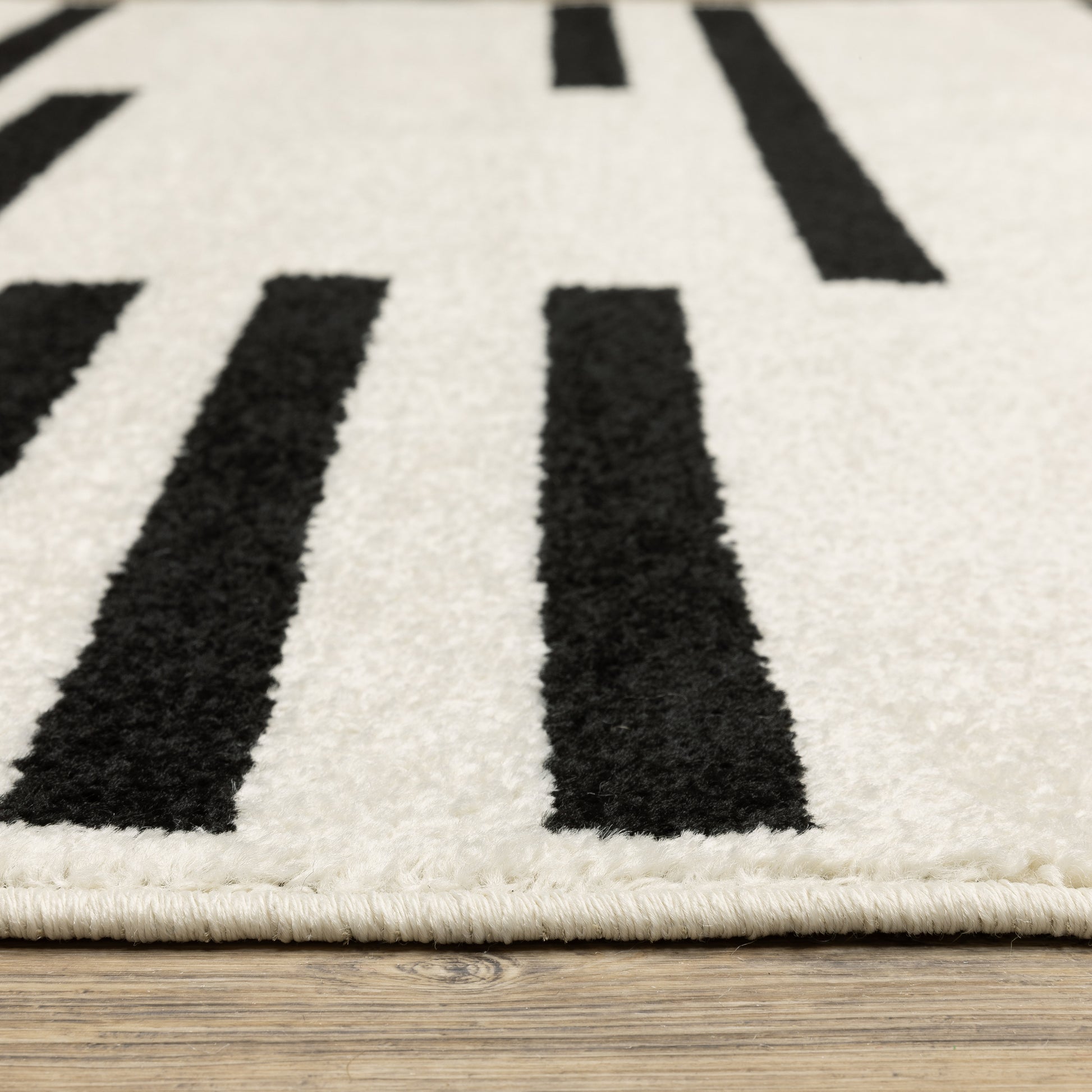 Quinn Stripe Beige/ Black Geometric Cut Pile Rug