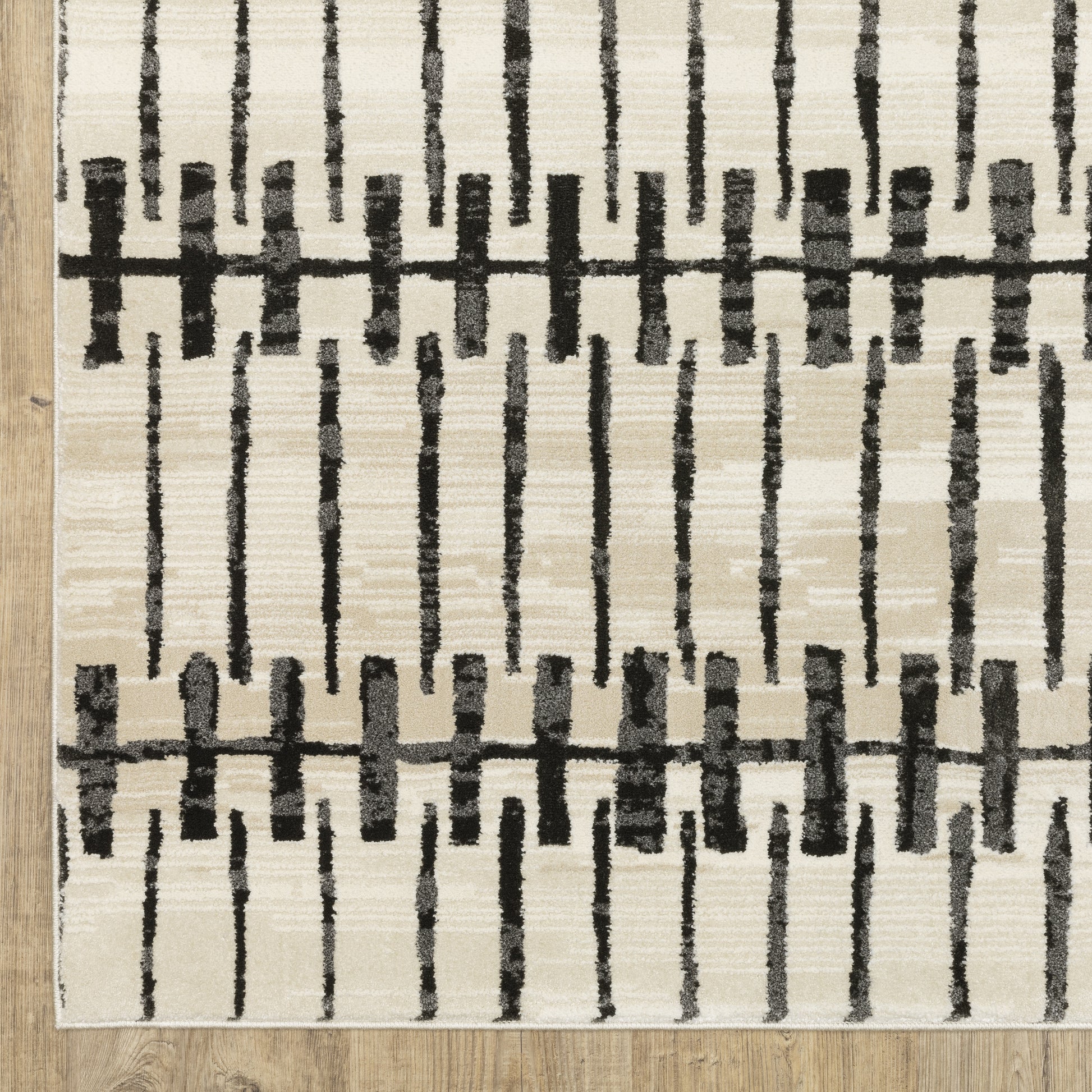 Raylan Abstract Ivory/ Black Geometric Cut Pile Rug