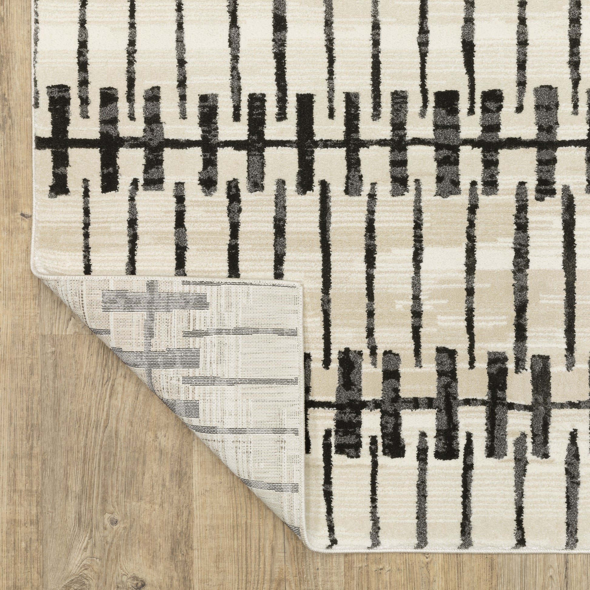 Raylan Abstract Ivory/ Black Geometric Cut Pile Rug