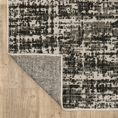 Torrey Outdoor Black/ Beige Distressed Loop Pile Rug
