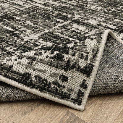 Torrey Outdoor Black/ Beige Distressed Loop Pile Rug